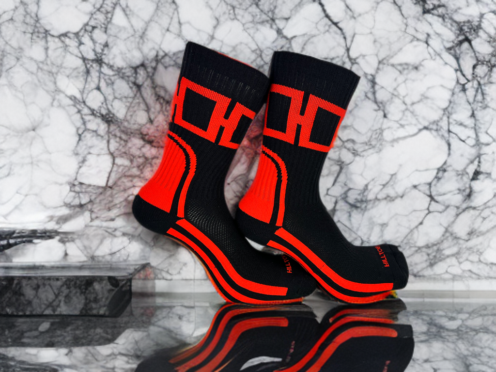 Black and red Hill Toe socks designed to complement the iconic Bred Jordan 11 sneakers, featuring a bold “H” design with reflective accents for a street-smart, athletic look.