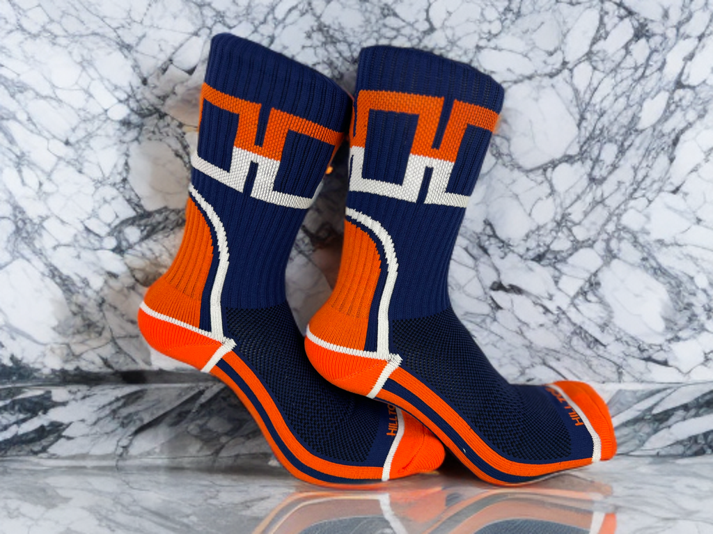 Navy, orange, and white Hill Toe sock with reflective H design, mesh panels, and arch support — inspired by Detroit baseball culture.