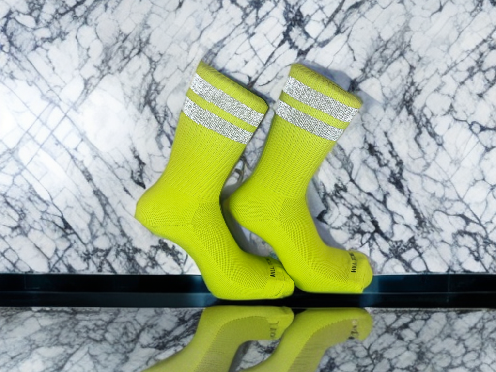 High-visibility neon yellow Hill Toe work sock with reflective safety stripes and moisture-wicking fabric.