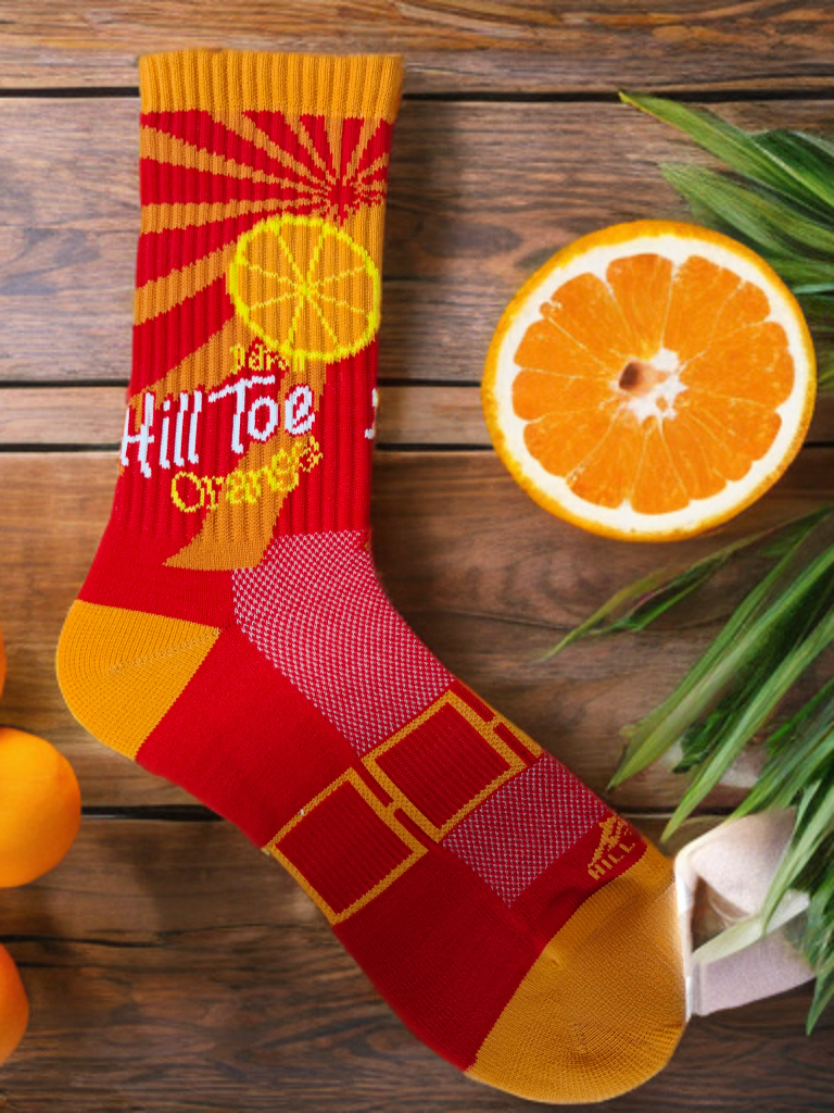 Hill Toe Orange Sunburst Edition sock with bright citrus tones, seamless toe, and performance features — a nod to Detroit’s iconic orange soda vibes.